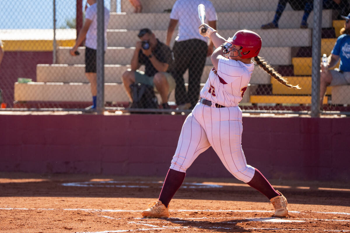 Pahrump Valley High School junior Evalenne Armendariz follows through on her swing during a non ...