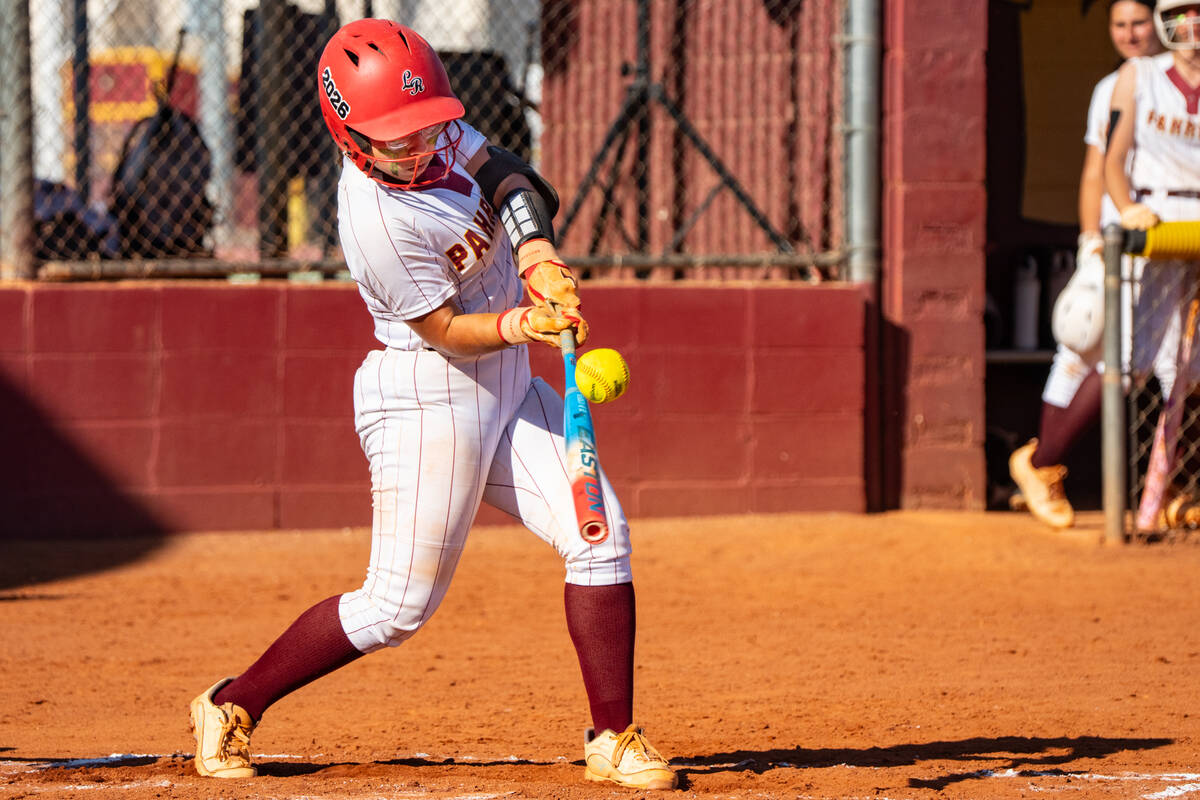 Pahrump Valley High School senior catcher Madison Rodriguez pieces up the ball at home against ...
