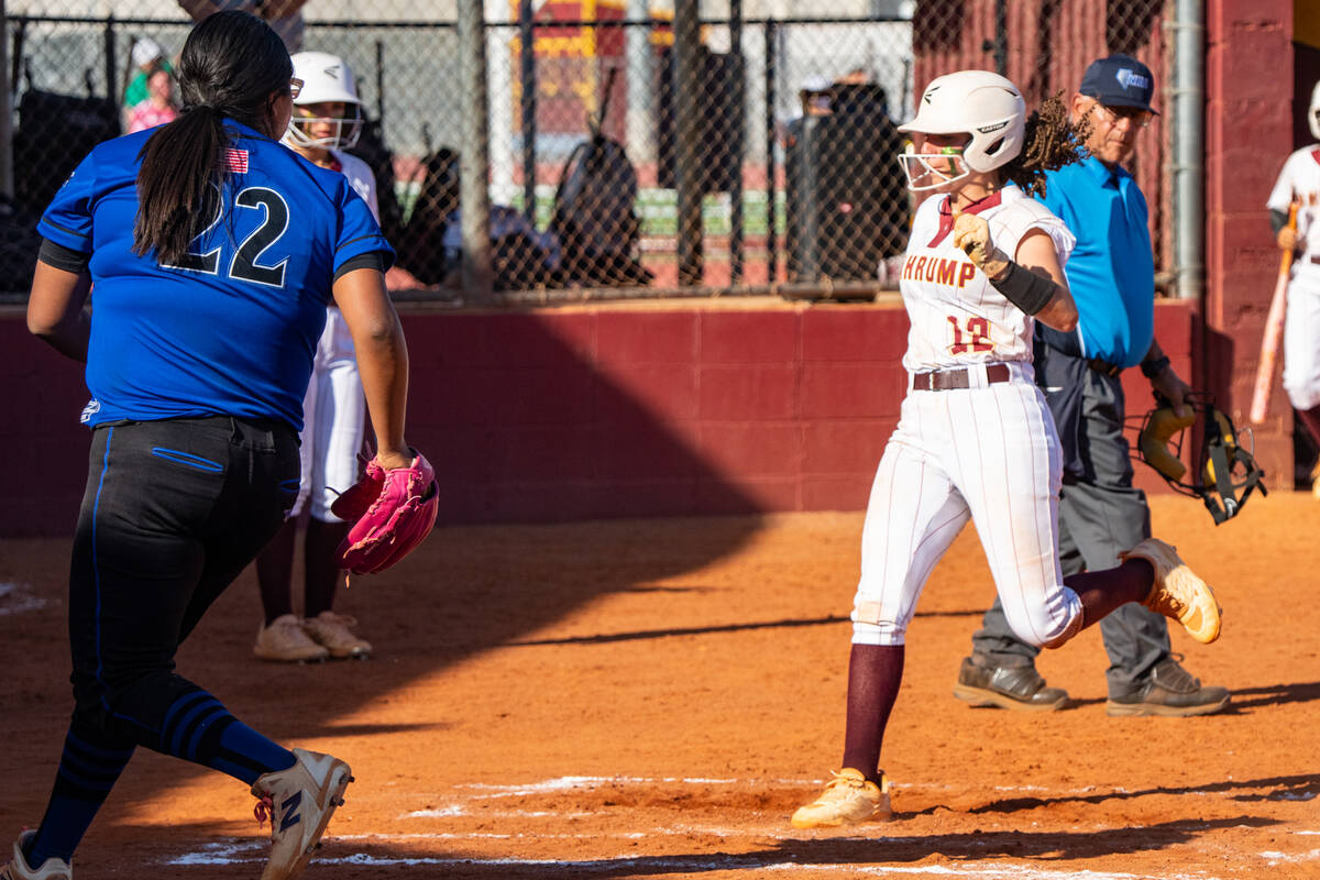 Pahrump Valley High School sophomore Mariah Gray reaches home safely against Needles High Schoo ...