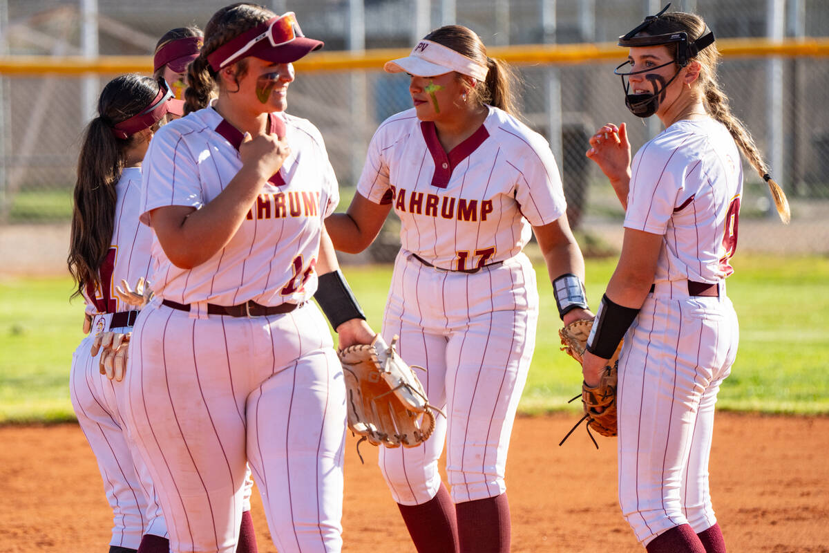 Pahrump Valley High School junior Evalenne Armendariz exits the mound with a smile after delive ...