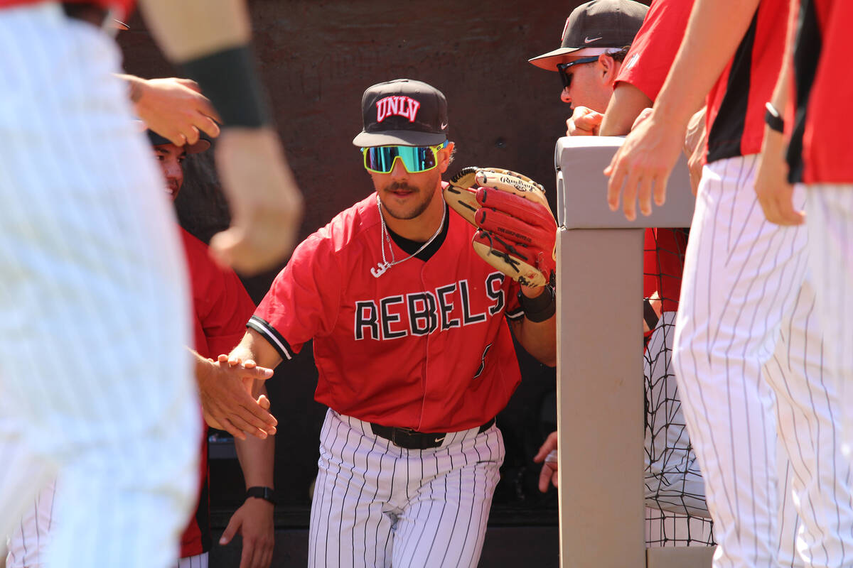 UNLV junior INF Jayden Hertel runs out the dugout during the Rebels' opening lineup announcemen ...