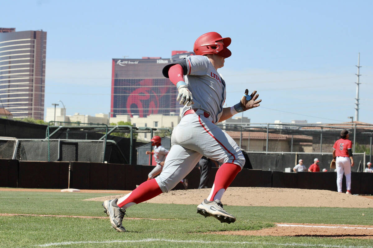 Former Pahrump Valley High School champion Kyle McDaniel takes off toward first base after maki ...