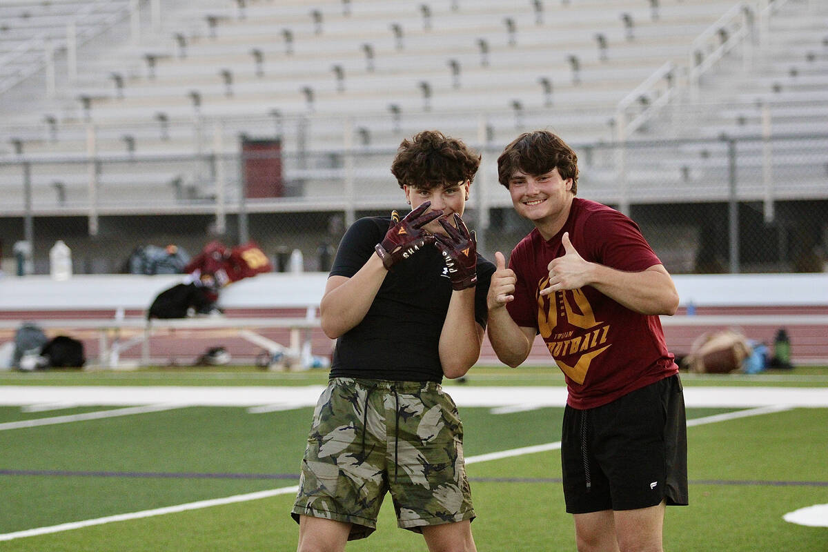 Pahrump Valley High School's juniors Ryan Hamlin and Aaron Rily flash a big smile during the Tr ...