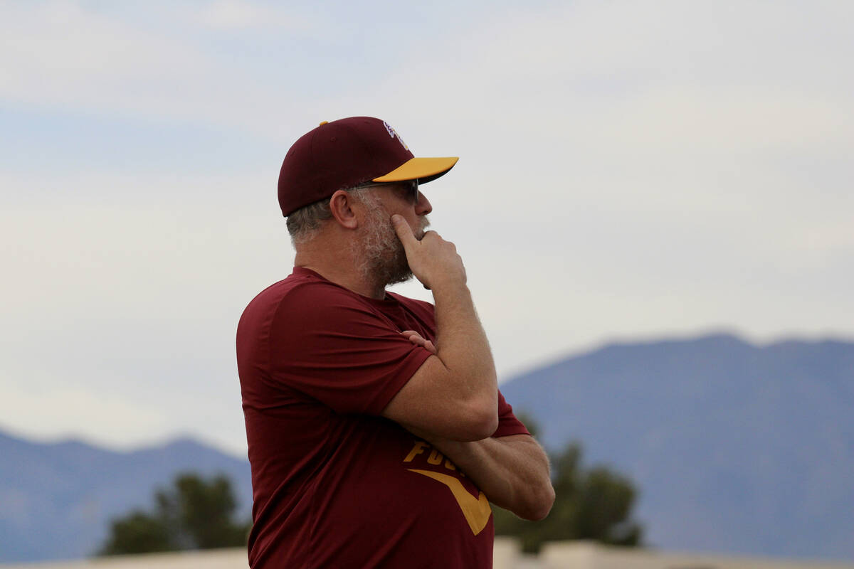 Newly appointed varsity head coach Toby Henry watches his squad during the first seven-on-seven ...