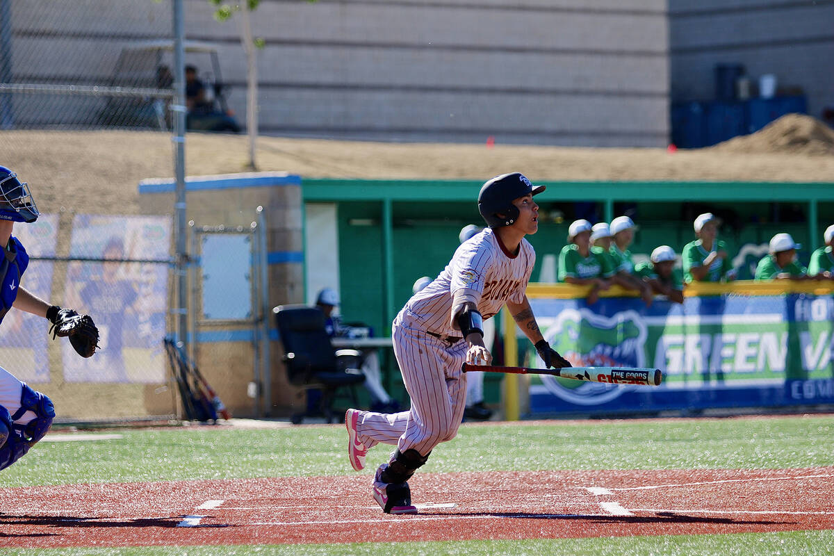 Pahrump Valley High School junior Jacob Selbach puts good wood on the ball in his at-bat agains ...