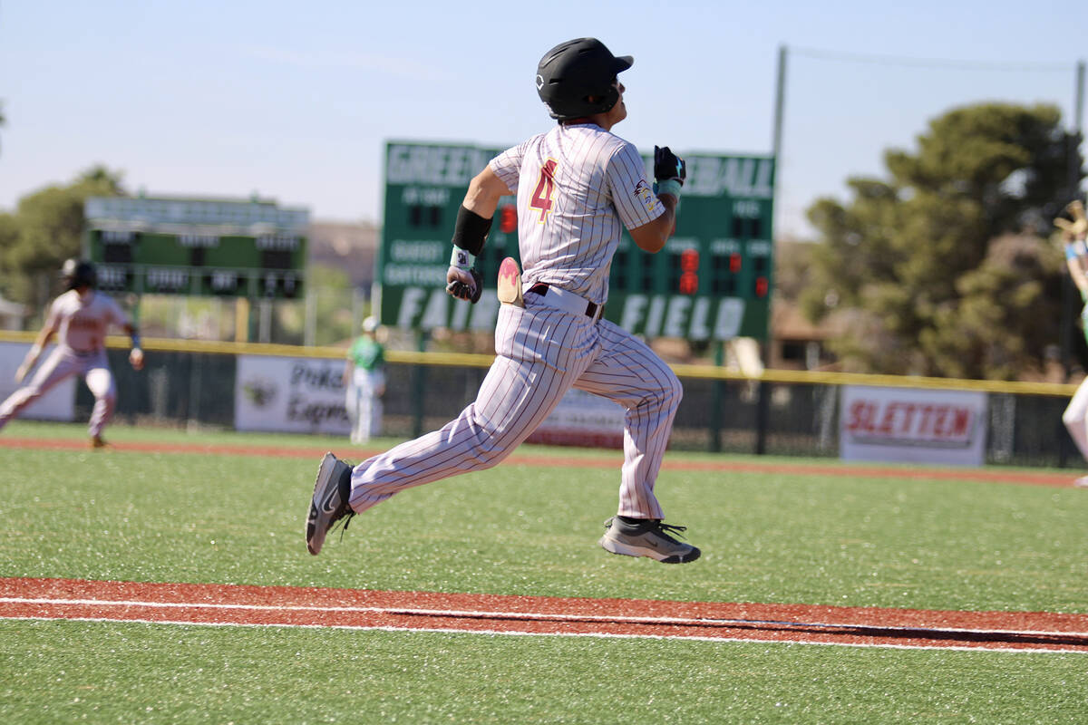 Pahrump Valley High School senior Dominik Wilson sprints out of the box after making contact on ...