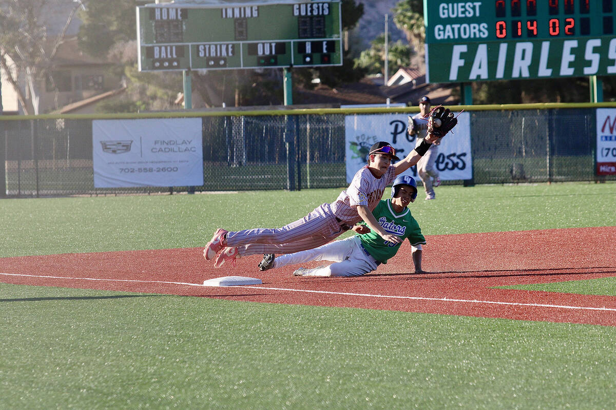 Pahrump Valley High School sophomore INF Anthony Montanez makes a diving catch to save an overt ...