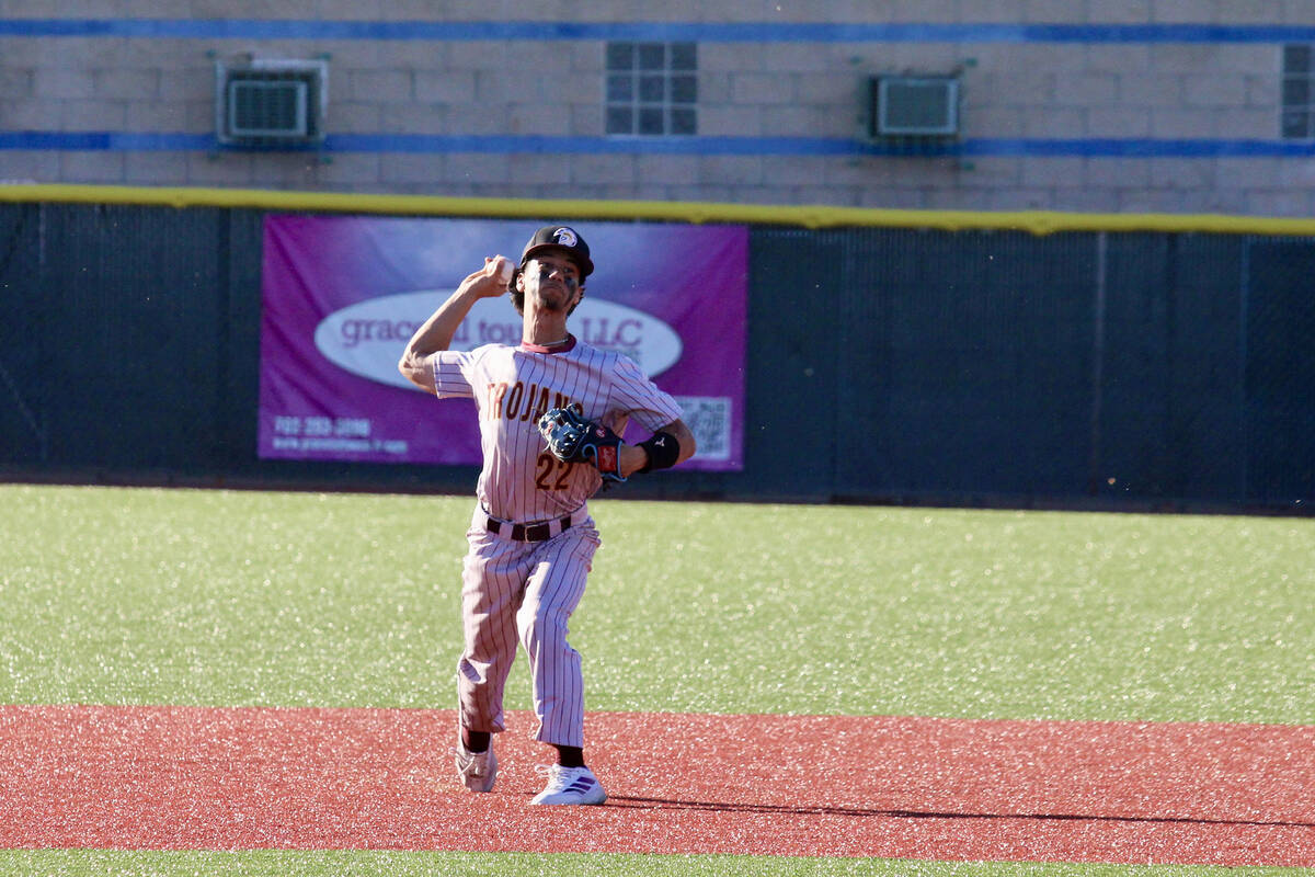 Pahrump Valley High School junior and shortstop Tony Whitney prepares to throw a runner out aft ...