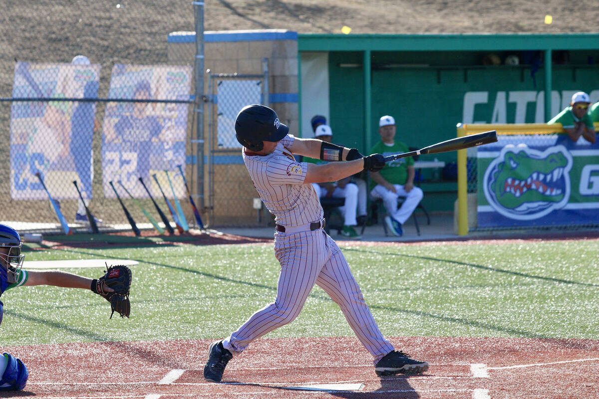 Pahrump Valley High School junior Cody Fried follows through on his backswing on the road again ...