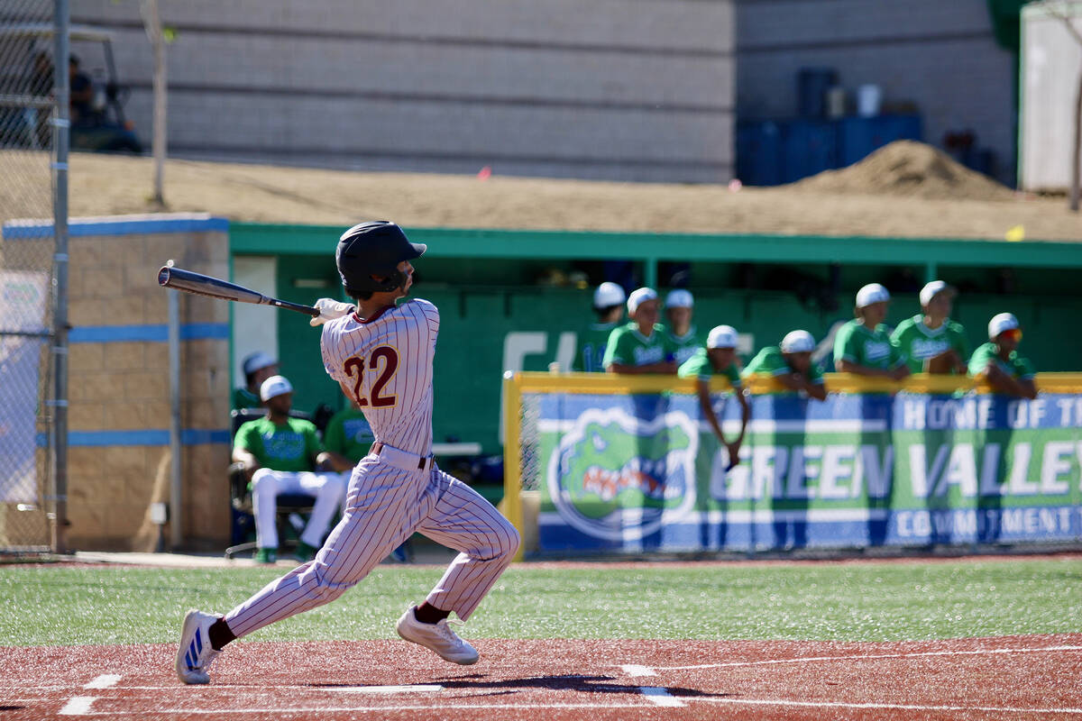 Pahrump Valley High School junior Tony Whitney pieces up a ball on the road against the Class 5 ...