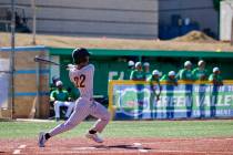 Pahrump Valley High School junior Tony Whitney pieces up a ball on the road against the Class 5 ...