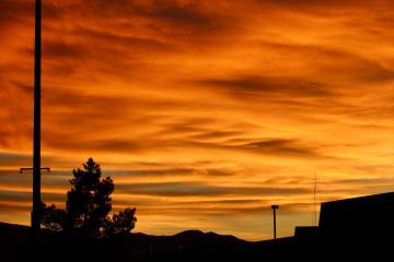 An orange-glowing sunset washes over Pahrump Valley High School on Monday, Mar. 23 following fo ...