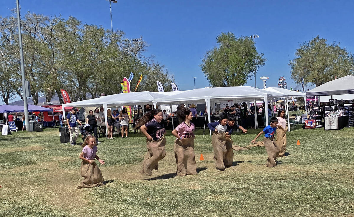 A group of youngsters give it their best shot in a potato sack race, just one of the games and ...