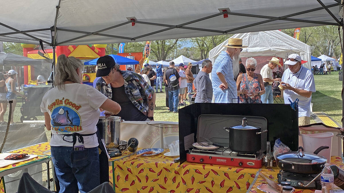 A Pahrump Chili Cook-Off attendee take a whiff of one of the competition participant's chili co ...