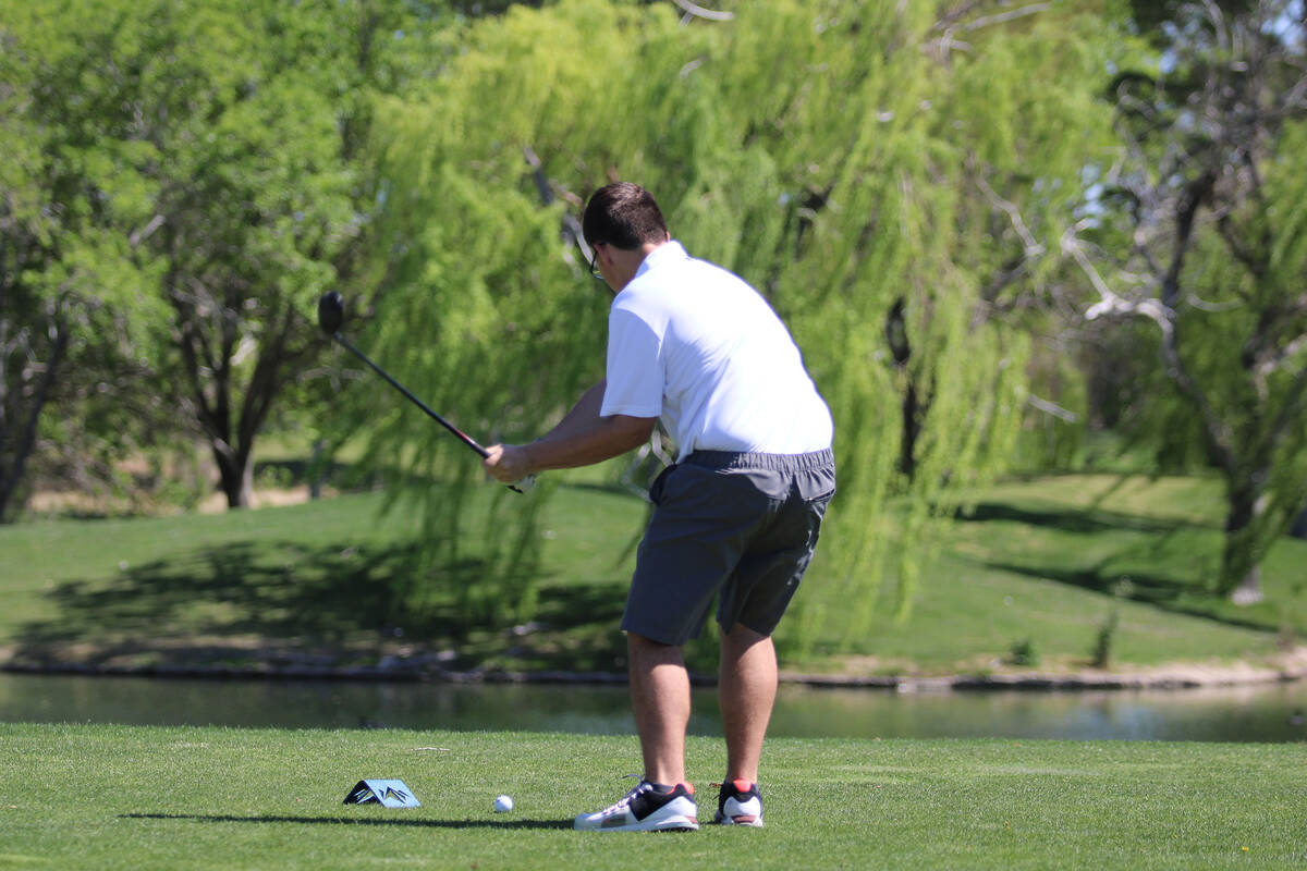 Pahrump Valley High School freshman Chase Hansen tees off on the back nine of the 18-hole dual ...