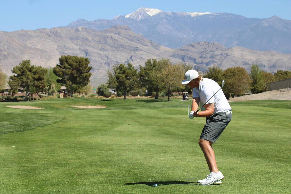Pahrump Valley High School freshman Brody Myers prepares to lift the ball during the Trojans' h ...