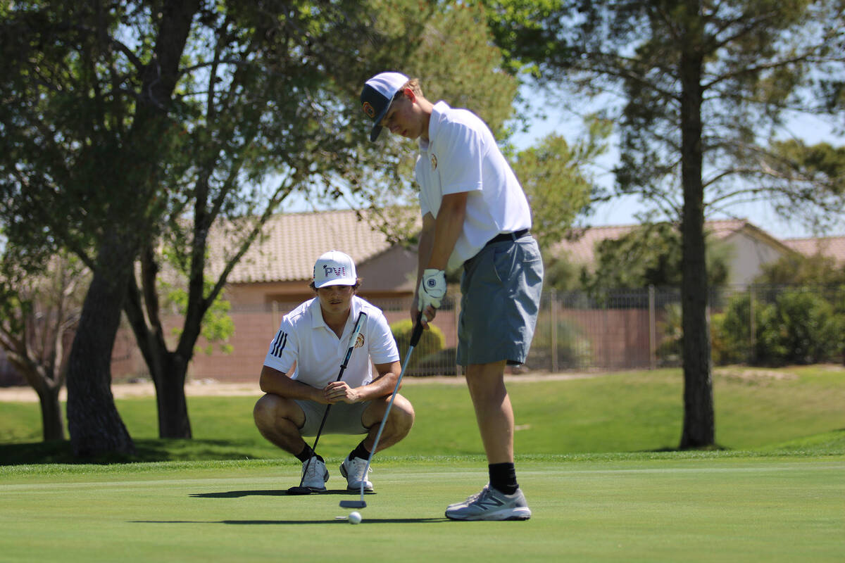Pahrump Valley High School junior TC Hone attempts to sink a putt at Mountain Falls Golf Course ...