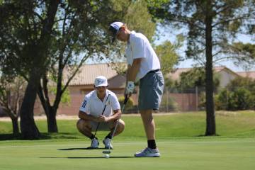 Pahrump Valley High School junior TC Hone attempts to sink a putt at Mountain Falls Golf Course ...