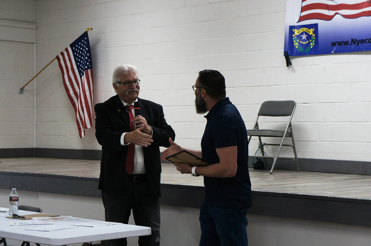 Nye County Republican Club President Joe Burdzinski (left) gives a certificate of recognition t ...