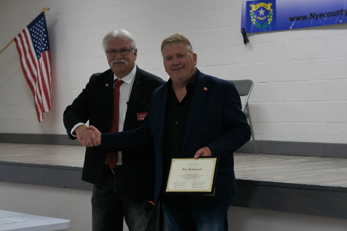 Nye County Republican Club President Joe Burdzinski (left) gifts a certificate of recognition t ...