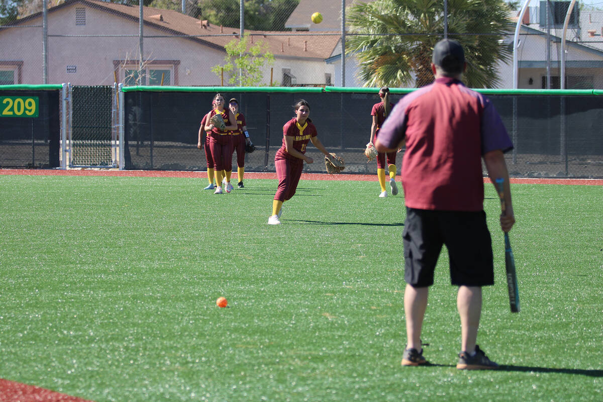 PVHS junior Sadie Freeman takes grounders prior to the start of the Trojans' non-league contest ...