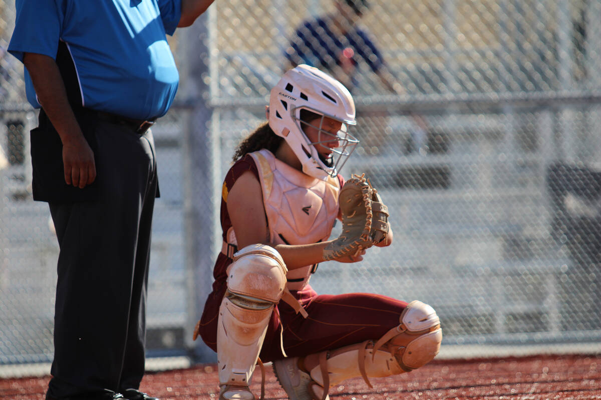 PVHS sophomore Mariah Gray checks what pitch to call next on her pitching chart prior to the st ...