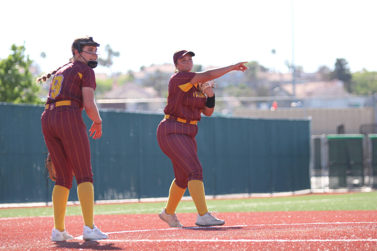 Pahrump Valley High School junior Evalenne Armendariz makes a play at third base during the Tro ...