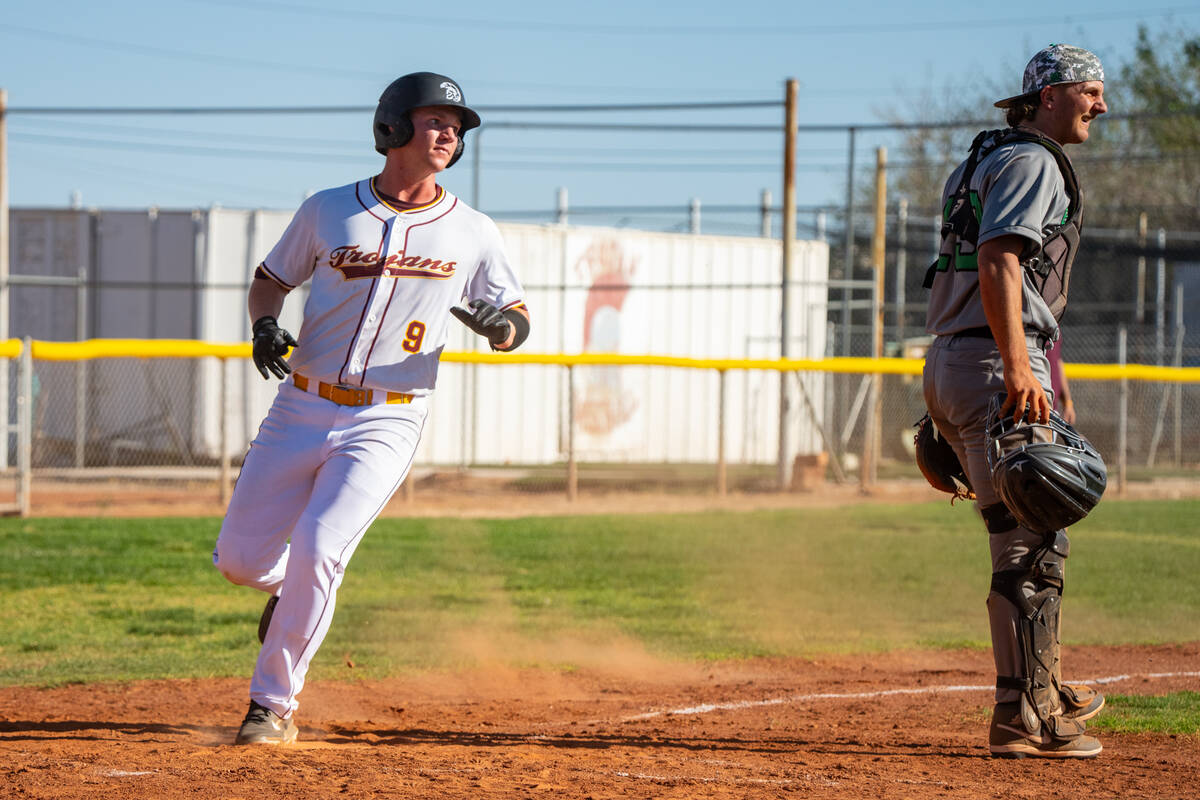 Pahrump Valley High School junior Cody Fried comes around to score during the first league game ...