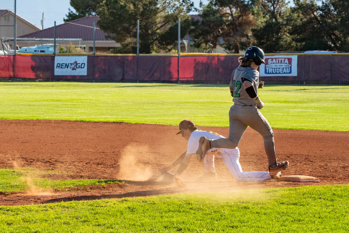 Pahrump Valley High School junior Dominic Chiancone digs a ball out at first base for the out d ...