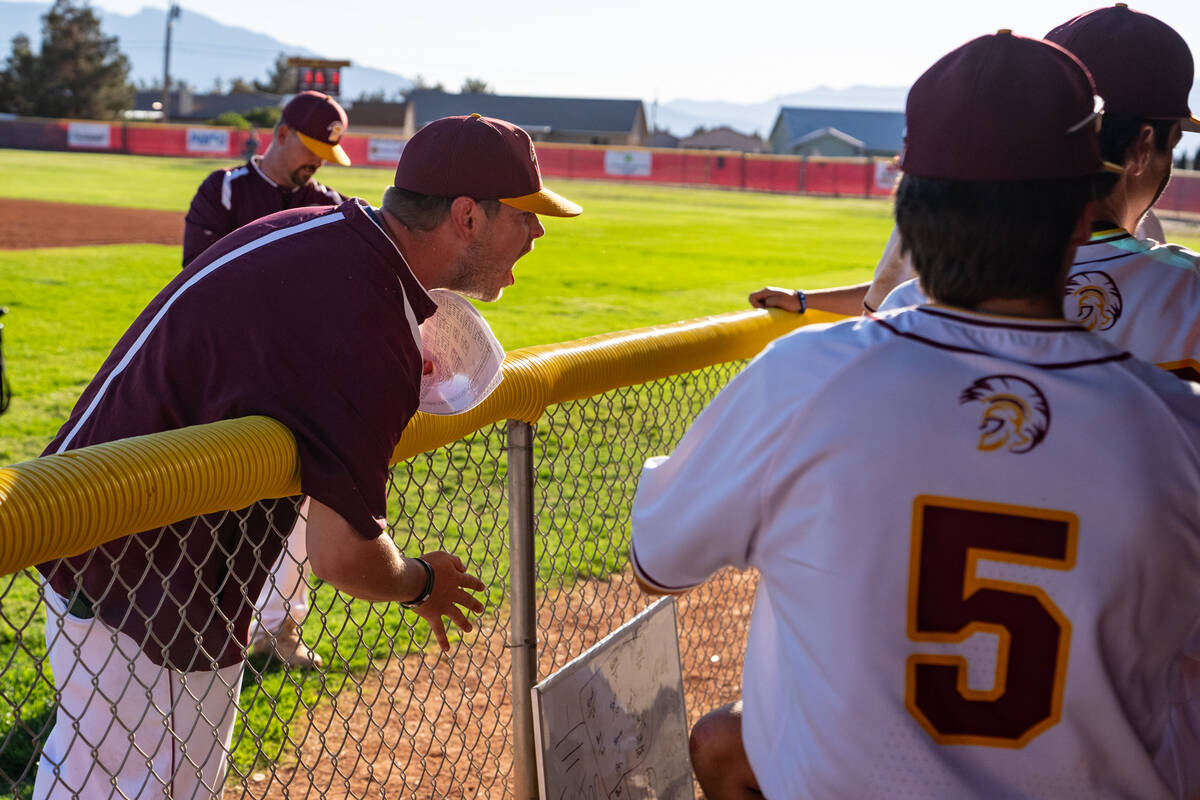 Pahrump Valley High School head coach Drew Middleton enthusiastically fires up the dugout durin ...