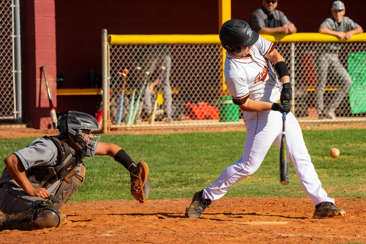 Pahrump Valley High School junior Cody Fried gets on base with a single during the first league ...
