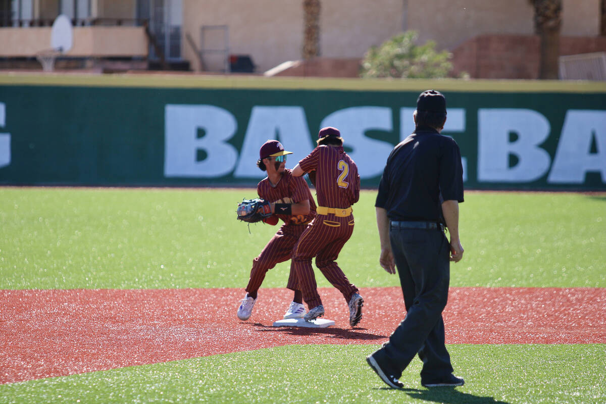 Pahrump Valley High School junior shortstop Tony Whitney attempts to turn a solo double play on ...