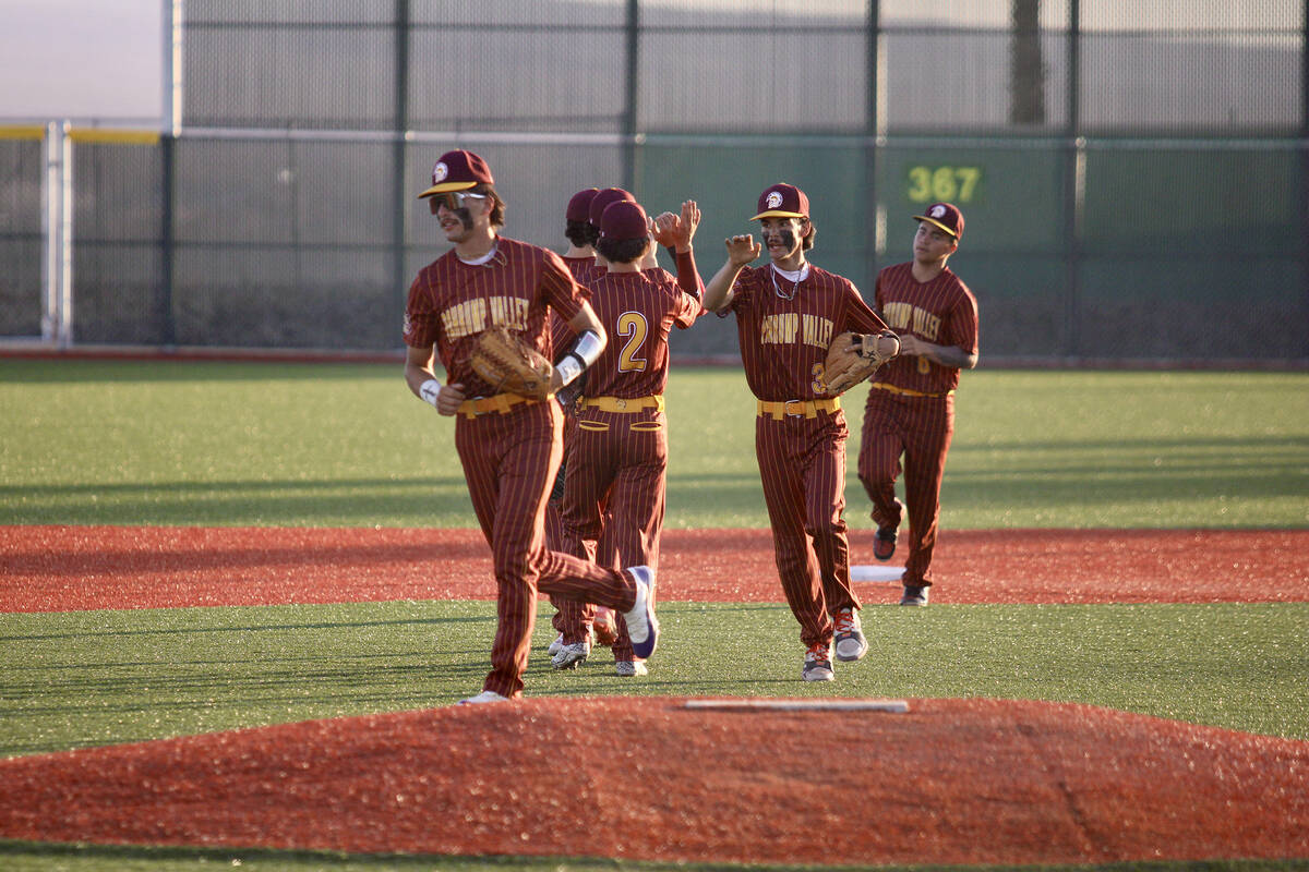 The Trojans celebrate their sweep of the Bulldogs during the end of the two-game league series ...