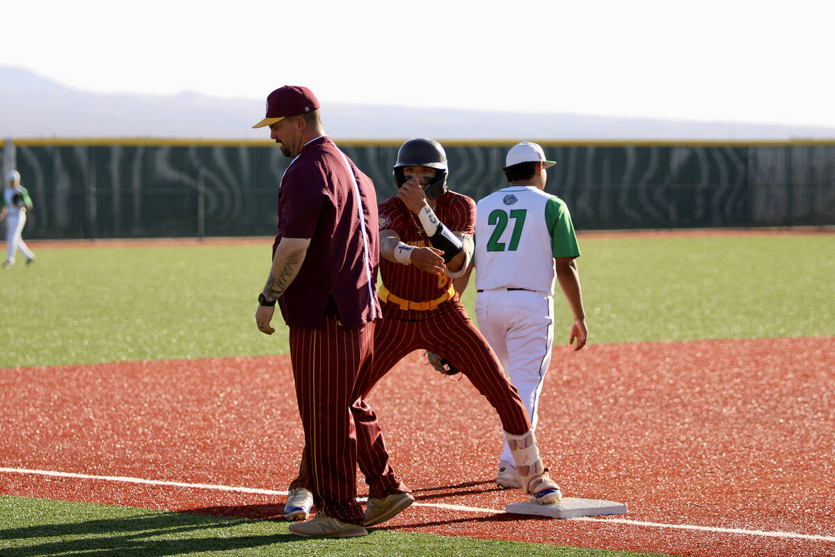 Pahrump Valley High School senior Kayne Horibe hits the dugout with a celebrational 'scuba' dan ...
