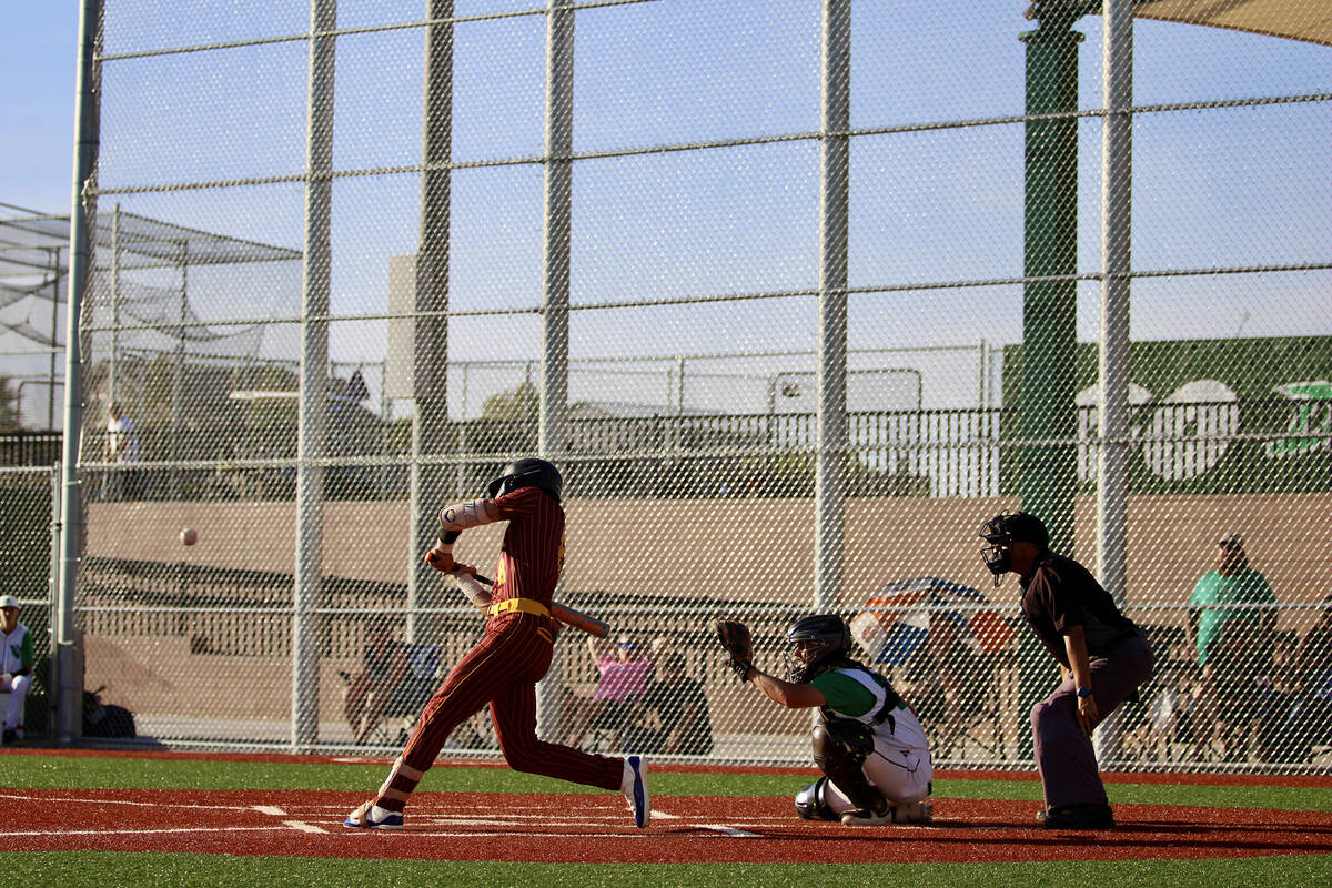 Pahrump Valley High School senior Kayne Horibe loads back on his backfoot to put a swing on the ...