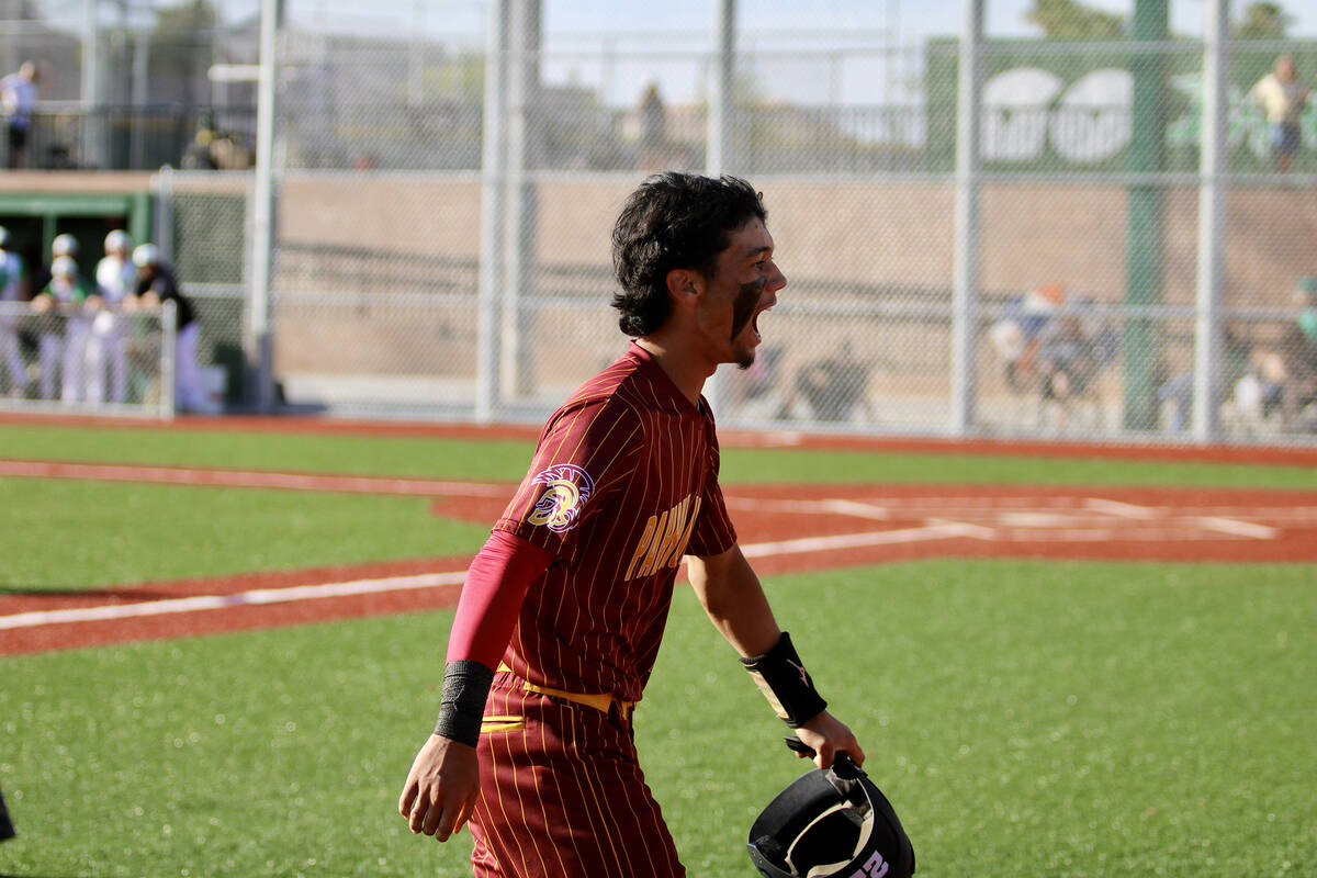Pahrump Valley High School junior Tony Whitney battle cries out to his dugout after putting a h ...