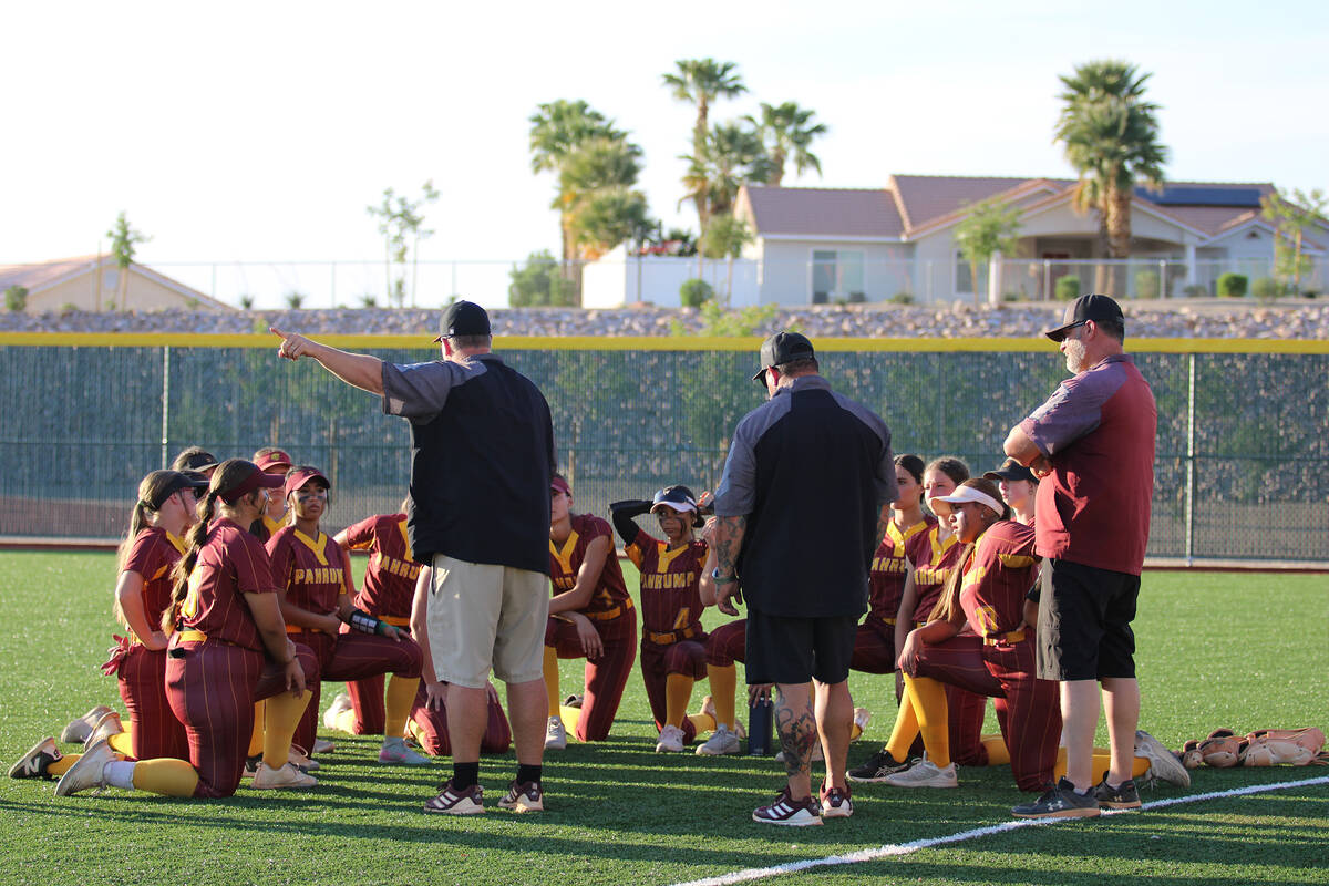 Pahrump Valley High School girls softball head coach Brian Hayes talks to the program following ...
