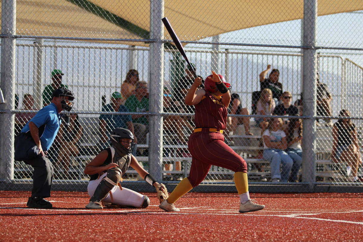 Pahrump Valley High School junior Evalenne Armendariz jumps on top of a pitch for an RBI agains ...