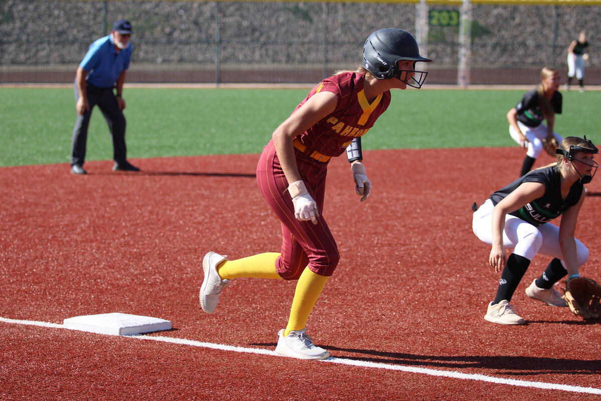 Pahrump Valley High School junior Riley Saldana gets a good jump off of third base against the ...
