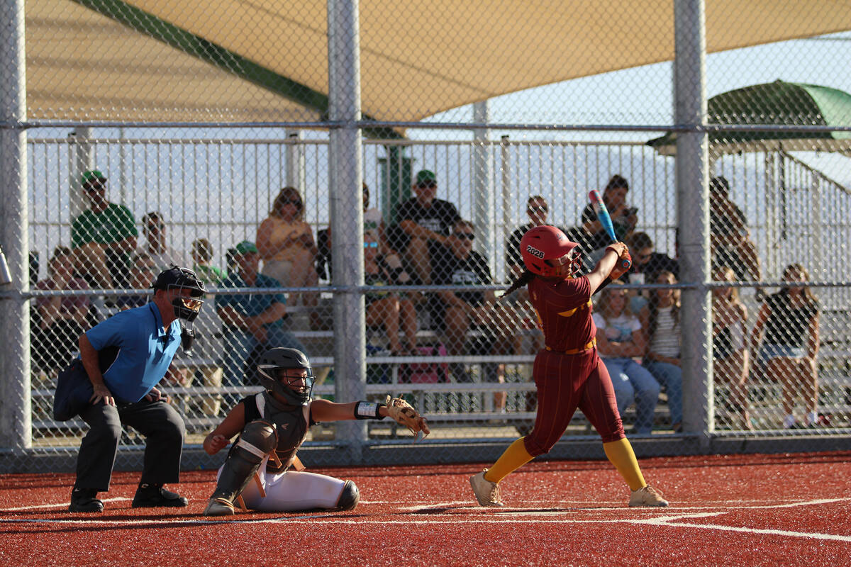 Pahrump Valley High School senior Madison Rodriguez takes a hack on the road against Virgin Val ...