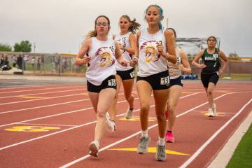 Pahrump Valley High School juniors Kaylan Robinson and Sophie Romero compete during the Pahrump ...