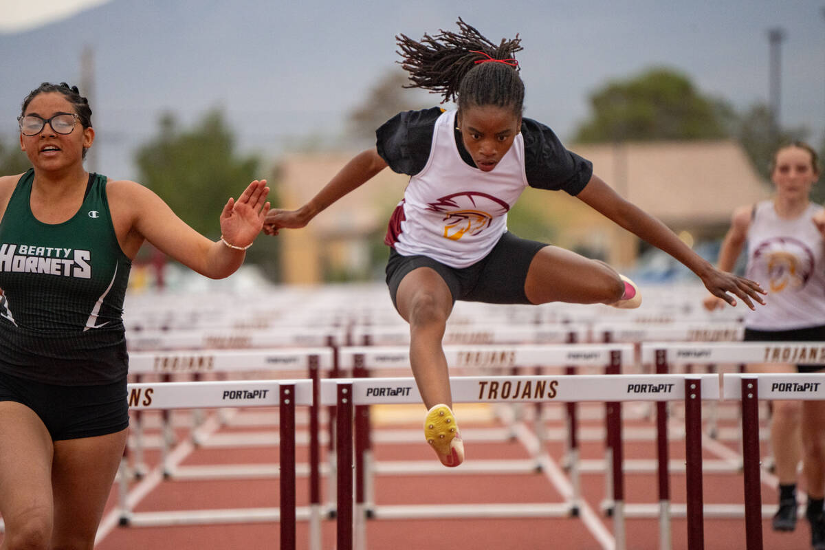 Pahrump Valley High School senior Diona Nixon competes in the 100-meter hurdles event, taking s ...