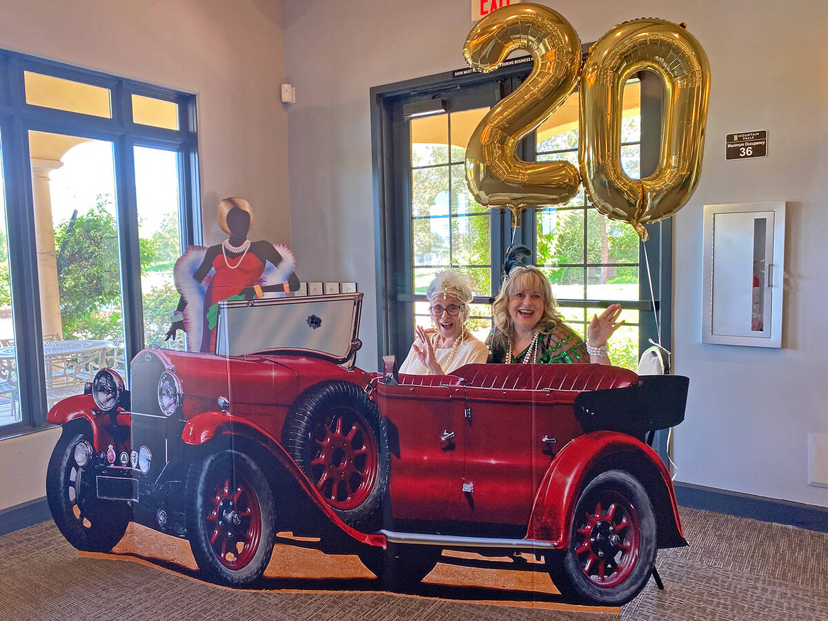 Pahrump Soroptimist members Willi Baer, left, and MaryRose Parkman, right, pose in a cardboard ...