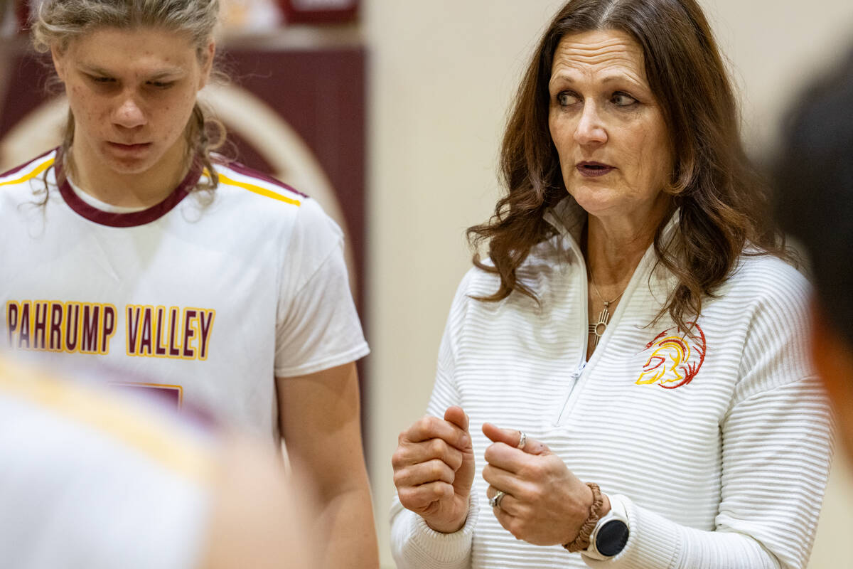 Pahrump Valley High School boys volleyball head coach Amber Lugo speaks to the team during a ti ...