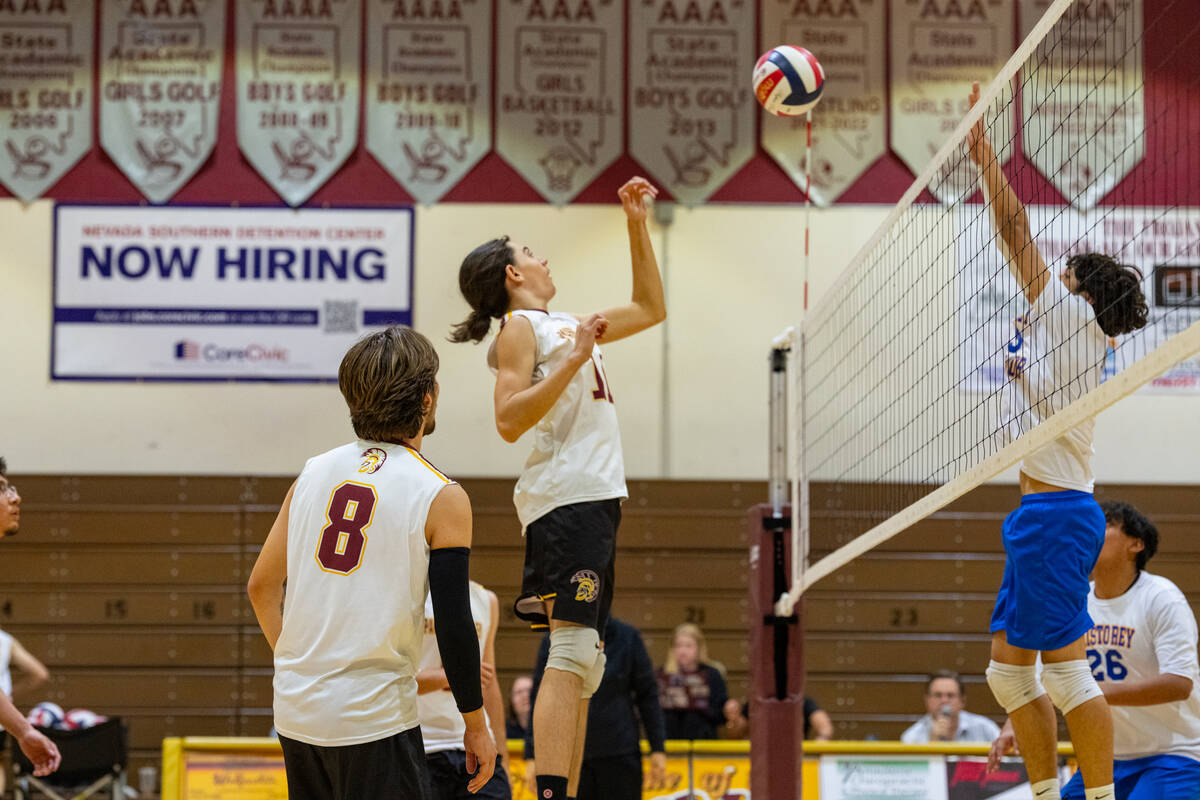 Pahrump Valley High School sophomore Kayden Doubleday prepares to block a returning spike durin ...