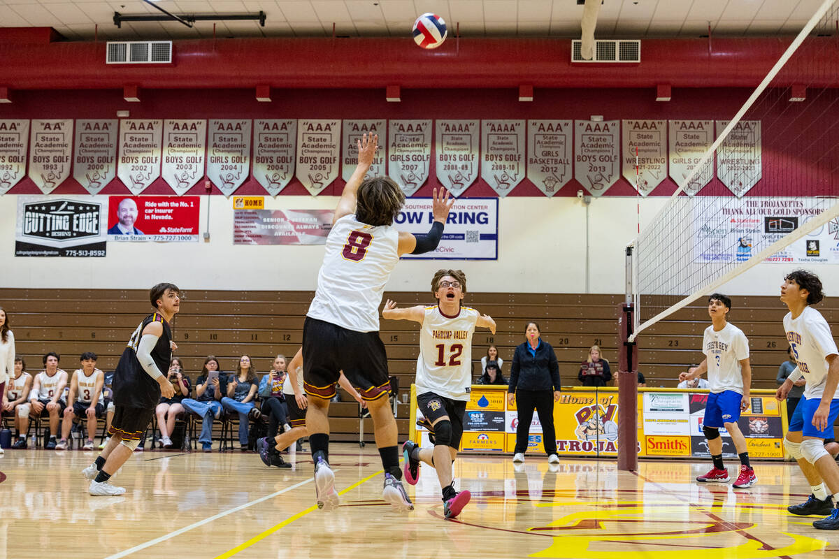 Pahrump Valley High School senior Elijah Thompson lobs a pass up to his teammate senior James W ...