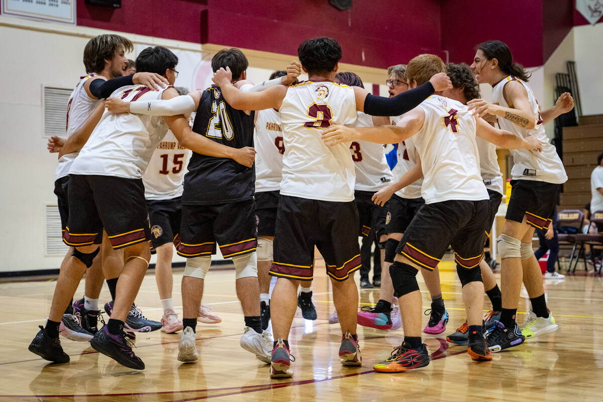 The Trojans varsity boys volleyball program gets hyped up together prior to the start of their ...