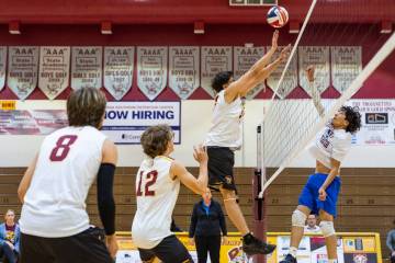 Pahrump Valley High School senior Andy Sanchez attempts a block on Cristo Rey St. Viator during ...