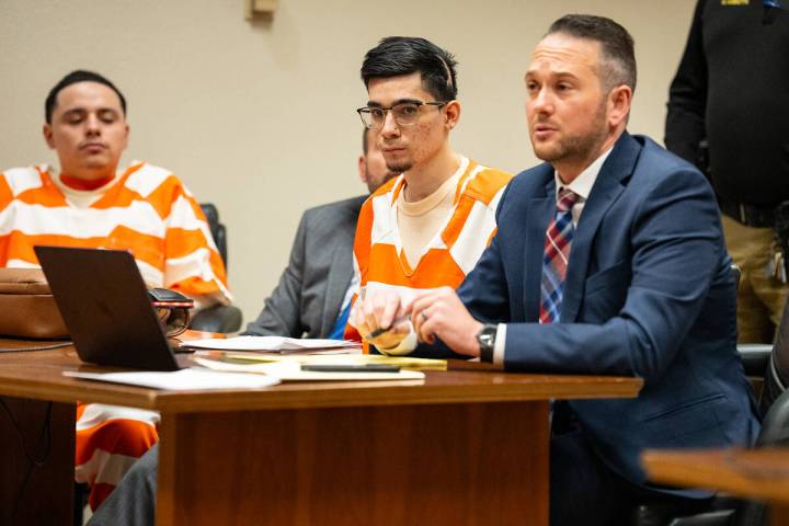 Anthony Aguilar (left), Carlos Blakely (center) and Blakely's attorney, Michael A. Troiano (rig ...