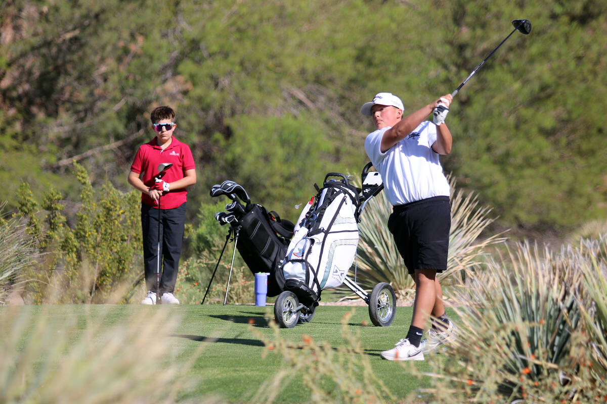 A Rosemary Clarke Middle School eighth-grader finishes his back-swing after driving a ball out ...